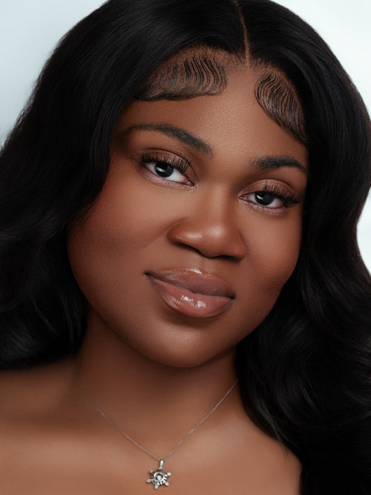 Close-up of a woman wearing natural-looking magnetic lashes with smooth skin and glossy lips