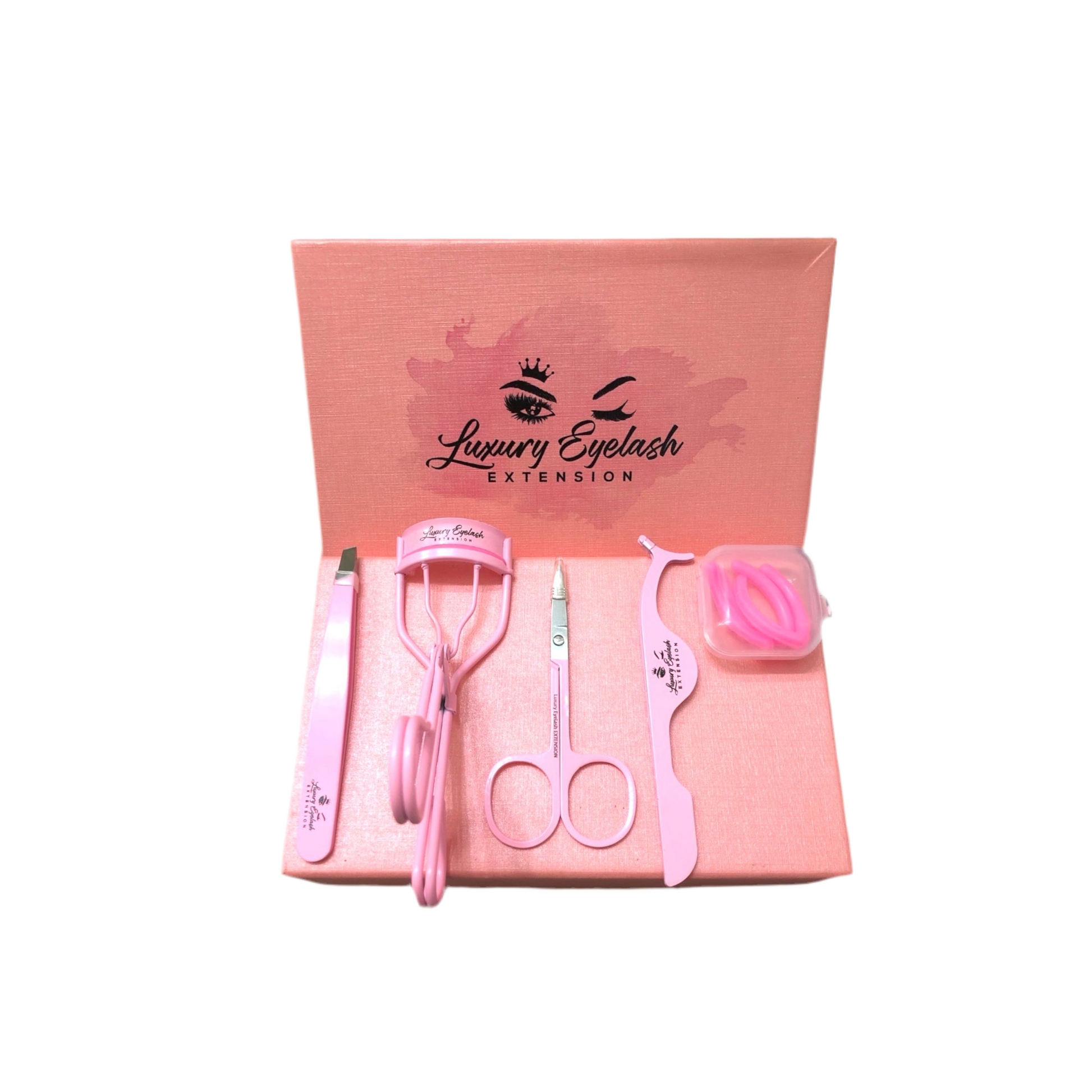 Pink stainless steel eyelash tools set including tweezers, curler, scissors, and applicator on a pink Luxury Eyelash Extension box
