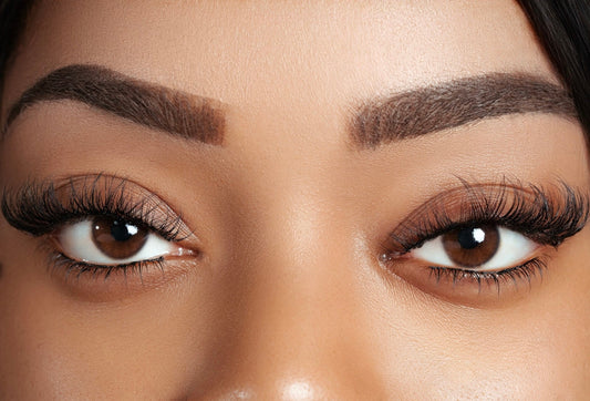 Close-up of brown eyes with soft, natural-looking mink cluster lashes enhancing volume and length.