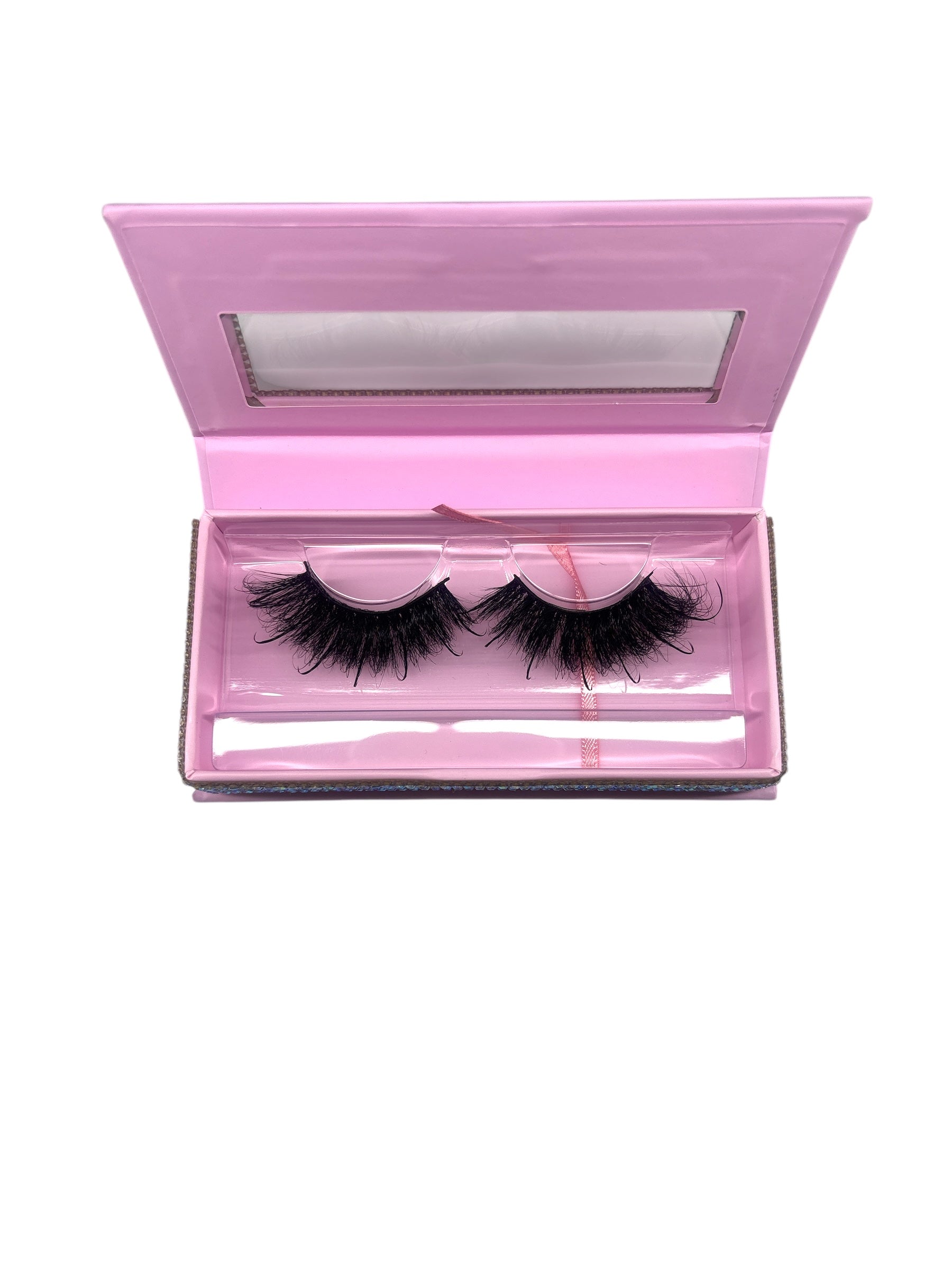 Luxe strip lashes in elegant pink packaging, offering a glamorous, extension-like effect for a stunning look.