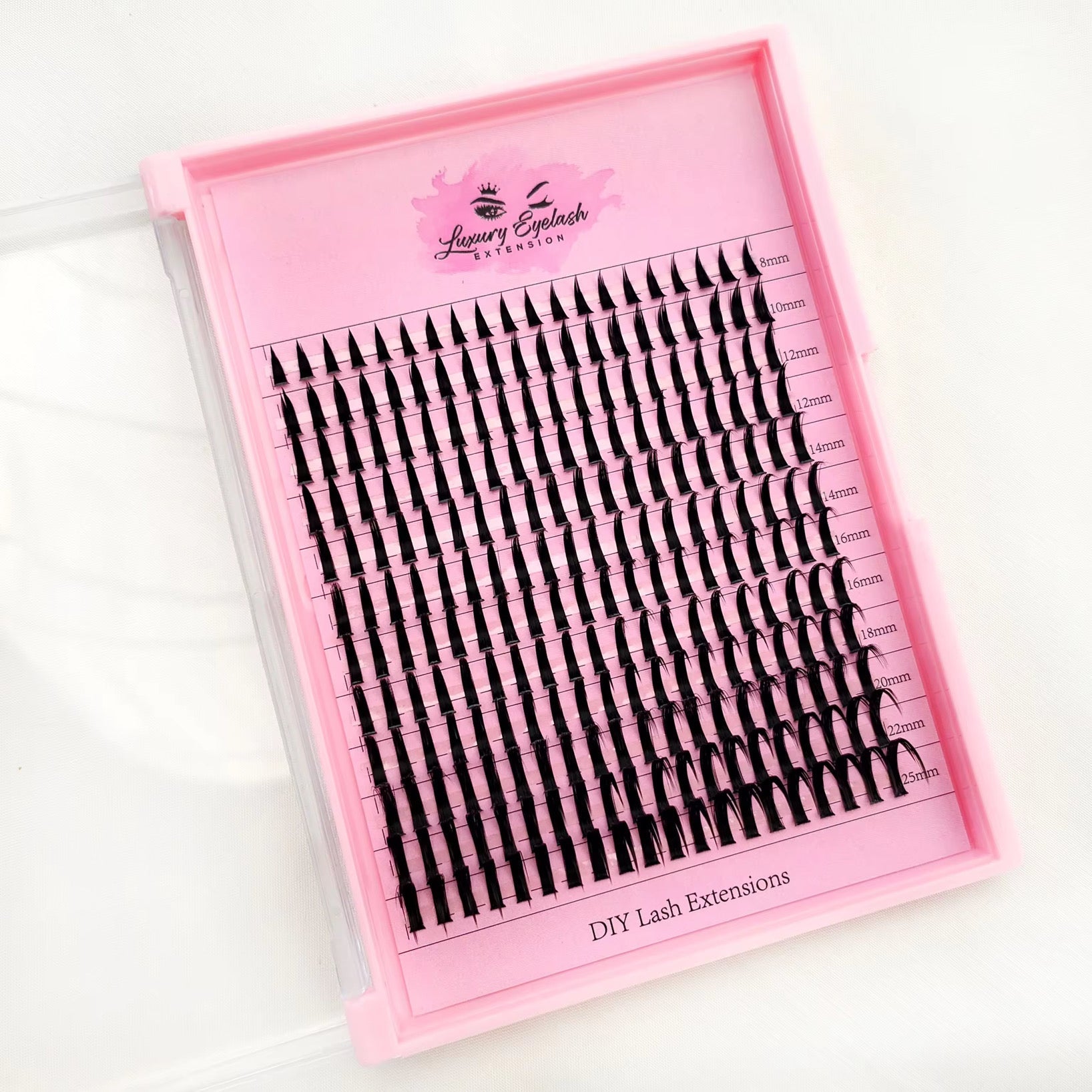 Luxury mink cluster eyelash extensions in various lengths from 8mm to 25mm in a pink tray labeled Clusters DY044