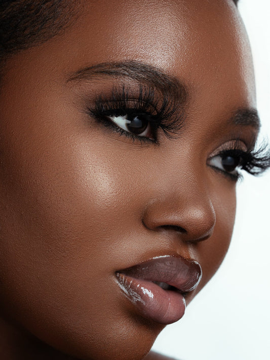Close-up of a woman wearing soft, voluminous Champagne lashes made from 100% real mink fur.