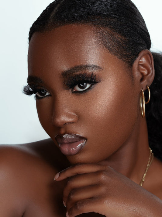 close-up of a woman wearing natural fuller look 25mm mink fur eyelashes with soft, fluffy texture and glossy finish