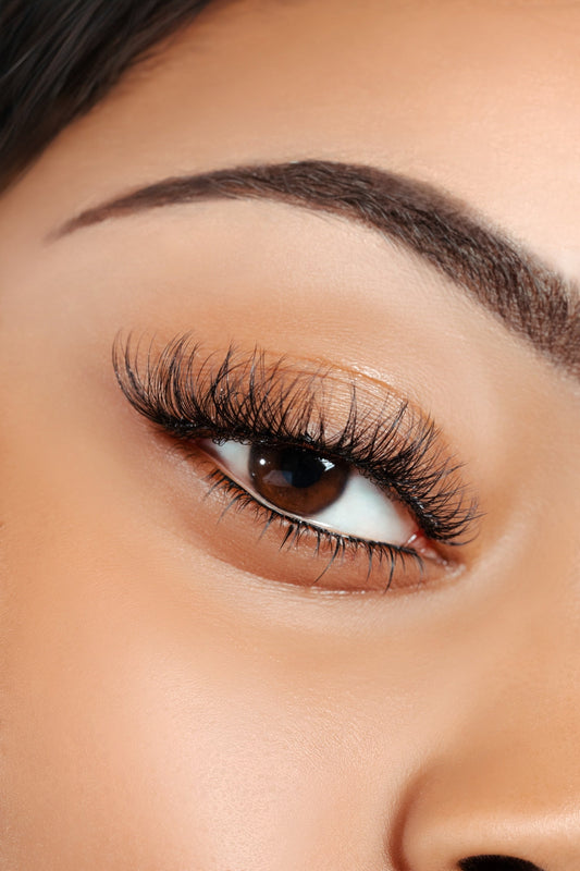 Close-up of an eye with luxurious mink cluster lashes enhancing natural volume and length